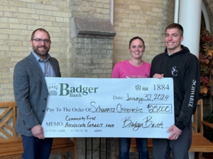 Photo of bakers and owners with the big check.